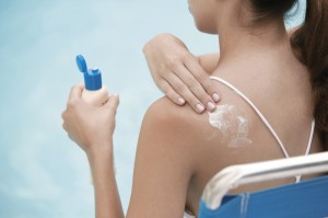 Woman Applying Sunscreen