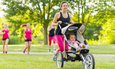 Woman walks with child.