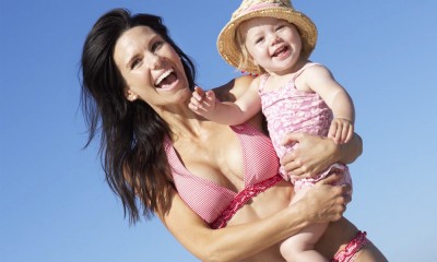 Woman holds baby.