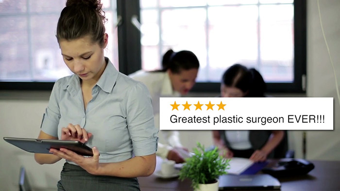 Checking plastic surgery reviews.