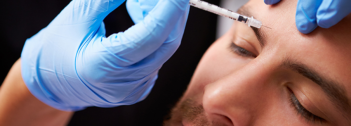 A man receives a Botox injection.